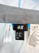 Nepromokavá bunda H&M, velikost 110-116 — second hand, velmi dobrý — detail 3